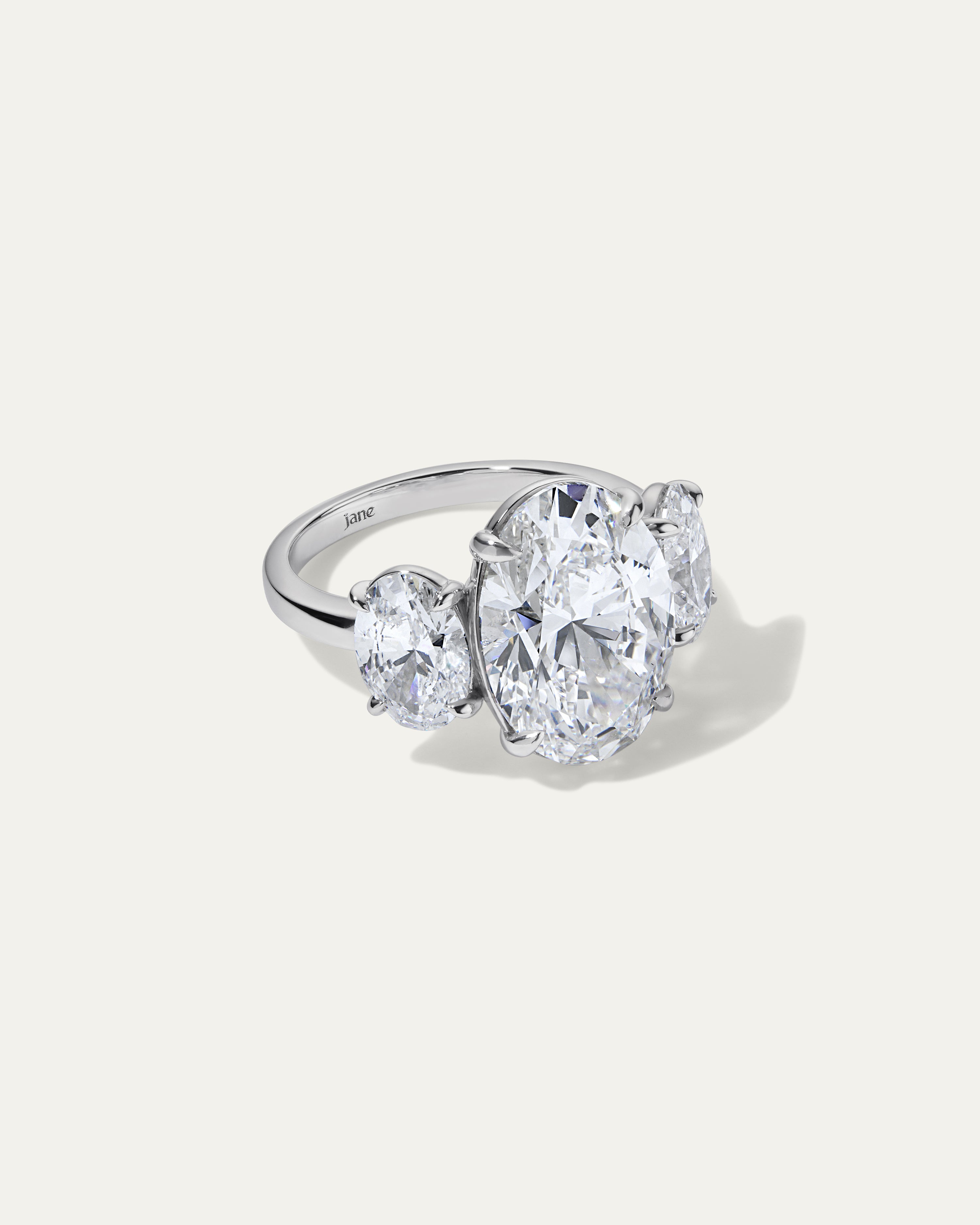8.02CT Oval Cut Three-Stone Diamond Ring with Side Stones